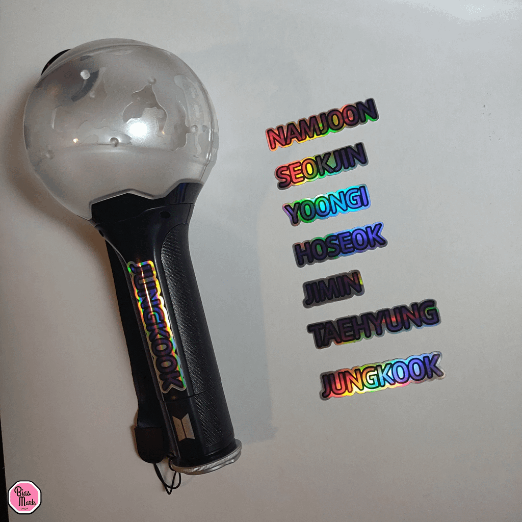 How to Tell If Your Lightstick Is Fake (Complete 2026 Guide) Image showing real holographic stickers for Army bomb BTS lightstick.